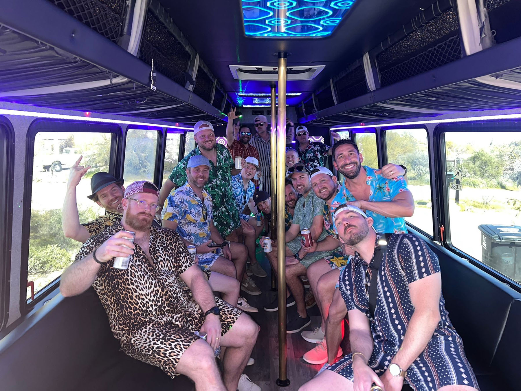 bachelor party sitting inside party bus